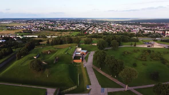 Flying towards suburbs of Kaunas city over the Ninth fort, a historical place, in beautiful drone ae