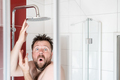 Man in the shower, in which the water stopped flowing due to a breaking or due to an energy crisis. - PhotoDune Item for Sale