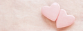 Two pastel pink hearts on pink linen background. - PhotoDune Item for Sale