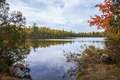 Small lake in northern Minnesota with pines birch and maple trees along the shore during autumn - PhotoDune Item for Sale