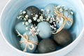 Colored Easter eggs in a bowl, closeup. Festive decoration. - PhotoDune Item for Sale