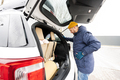Man wipes trunk of american SUV car with a microfiber cloth after washing in cold weather. - PhotoDune Item for Sale