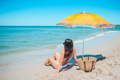 Young beautiful woman relaxing at white sand tropical beach  - PhotoDune Item for Sale
