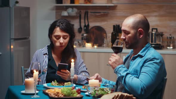 Surfing on Phones During Dinner