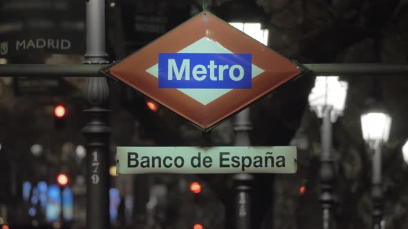 Night View of Banco De Espana Metro Sign in Madrid, Spain