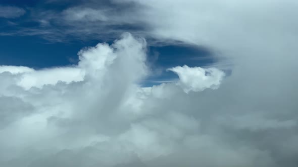 Awesome pilot point of view flying a jet through clouds avoiding bad weather ahead doing some turns