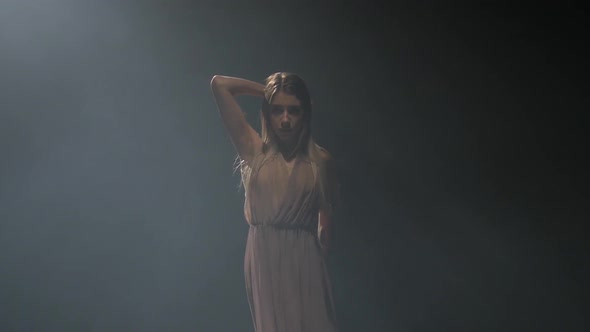 Close-up Slow Motion, Professional Performer Practicing Contemporary in Dark Studio.