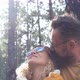 portrait of couple of two happy people looking at the trees in the forest and enjoying together - VideoHive Item for Sale