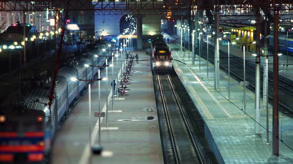 Night timelapse shooting. Passengers board a modern electric train.