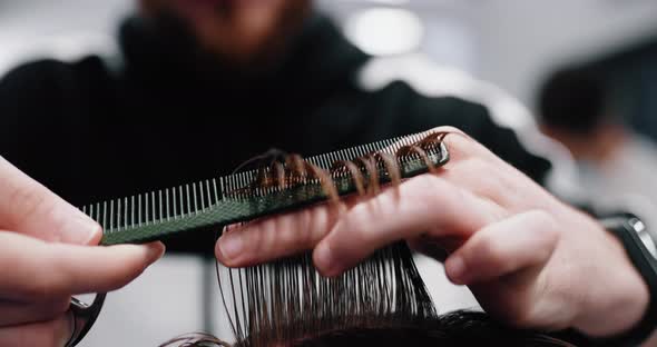 Haircut with Scissors, Close-up. Getting the Services of a Hairdresser, Stylist