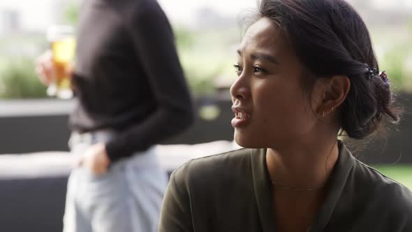 Friends discussing on a rooftop