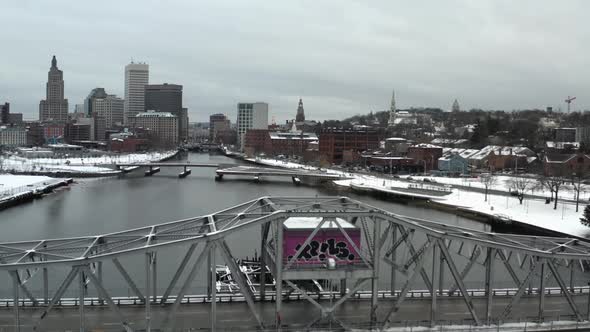 Cars Driving Across Bridge Over Providence River With Downtown Providence Skyline In Winter In Rhode