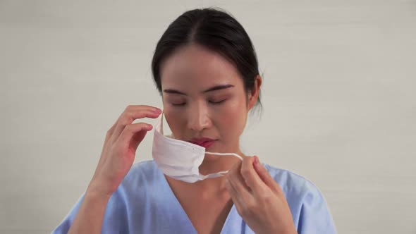 Young Asian Woman Showing COVID19 Vaccine Bandage Merrily