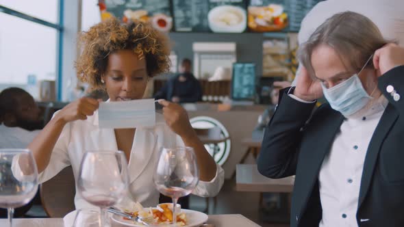 Portrait of Diverse Business Colleagues Putting on Mask and Leaving Cafe