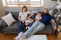 Parents with children on the couch - PhotoDune Item for Sale