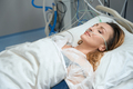 Pretty female lies in intensive care in clinic - PhotoDune Item for Sale