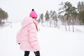 Young red haired woman in pink sportswear and sunglasses on winter snowy background - PhotoDune Item for Sale