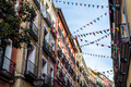 Street decorated with pennants in the traditional neighborhood of Embajadores - PhotoDune Item for Sale