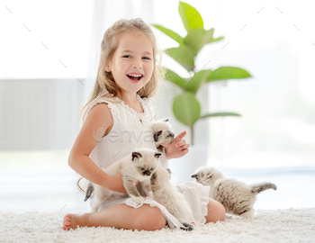 g. Little female person with purebred kitty pets at home
