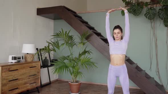 Young Woman Doing Gymnastics at Home