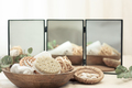 Spa composition with body care products on a blurred background with a mirror. - PhotoDune Item for Sale