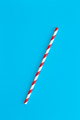 Close up of drinking straw for party on blue background, flat lay. - PhotoDune Item for Sale