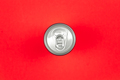 Aluminum drink or beverage can with pull ring on a red background, flat lay. - PhotoDune Item for Sale