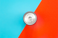 Aluminum drink or beverage can with pull ring on colored background, flat lay. - PhotoDune Item for Sale