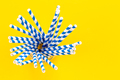 Paper straws for drinks on a yellow background, top view. - PhotoDune Item for Sale
