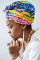 Portrait of young african woman with colorful shawl on her head and ethnic jewelry. African - PhotoDune Item for Sale