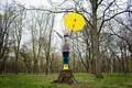 Baby Boomers and mental health. Happy senior woman in yellow rain coat with yellow umbrella jumping - PhotoDune Item for Sale