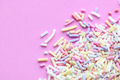 Pastel sprinkles on a pink background - PhotoDune Item for Sale