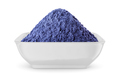 Butterfly pea flower powder or blue matcha in round bowl isolated on white. Front view. - PhotoDune Item for Sale