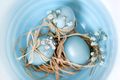 Baby blue colored Easter eggs in a bowl, top view closeup. Festive decoration. - PhotoDune Item for Sale
