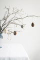 Easter paper eggs hanging on branches. - PhotoDune Item for Sale