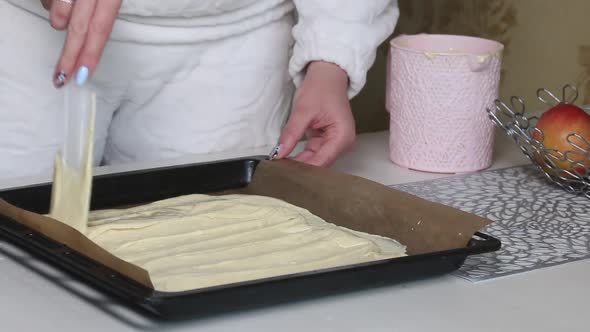 A Woman Smoothes The Dough On A Baking Sheet. Cooking Biscuit Cake Dairy Girl
