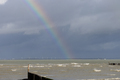 An empty North sea beach with a rainbow in Breskens - PhotoDune Item for Sale