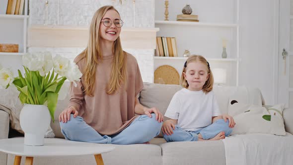 Young Mother Mindful Mum Teaches Child Beloved Little Daughter Baby Meditate Sitting in Lotus