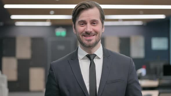 Portrait of Businessman Talking on Online Video Call