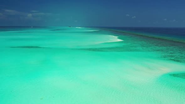 Aerial flying over tourism of tropical shore beach vacation by clear sea with white sandy background