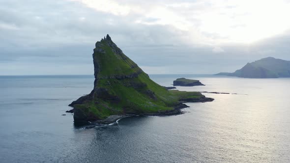 Drone Towards Drangarnir Sea Stacks In Faroe Islands