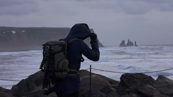 Photographer Turning From Rough Sea From Rocks