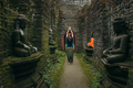 Woman with raised hands in spiritual Buddhist place - PhotoDune Item for Sale