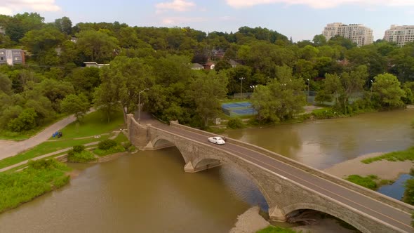 Aerial shot of old classic Rolls Royce car on a bridge