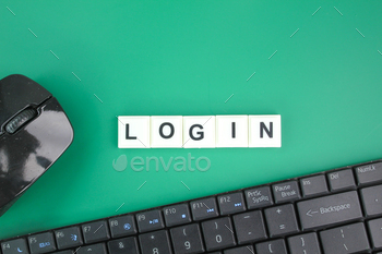 mouse and laptop keyboard with the word login.