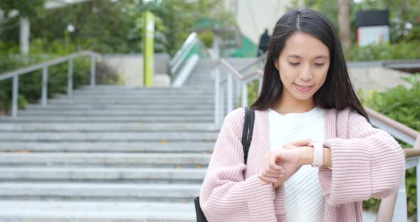 Woman using smart watch at outdoor