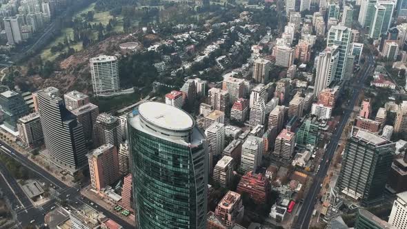 Aerial drone shot closing on building rooftop with helipad