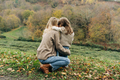Rear view of a mother hugging her daughter on a walk. - PhotoDune Item for Sale