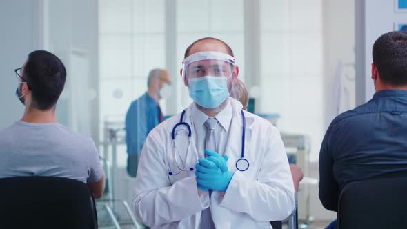 Portrait of Tired Doctor with Face Mask and Visor