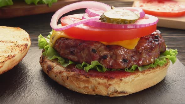 Cucumbers Are Placed on the Top of the Homemade Grilled Burger with Meat Cutlet